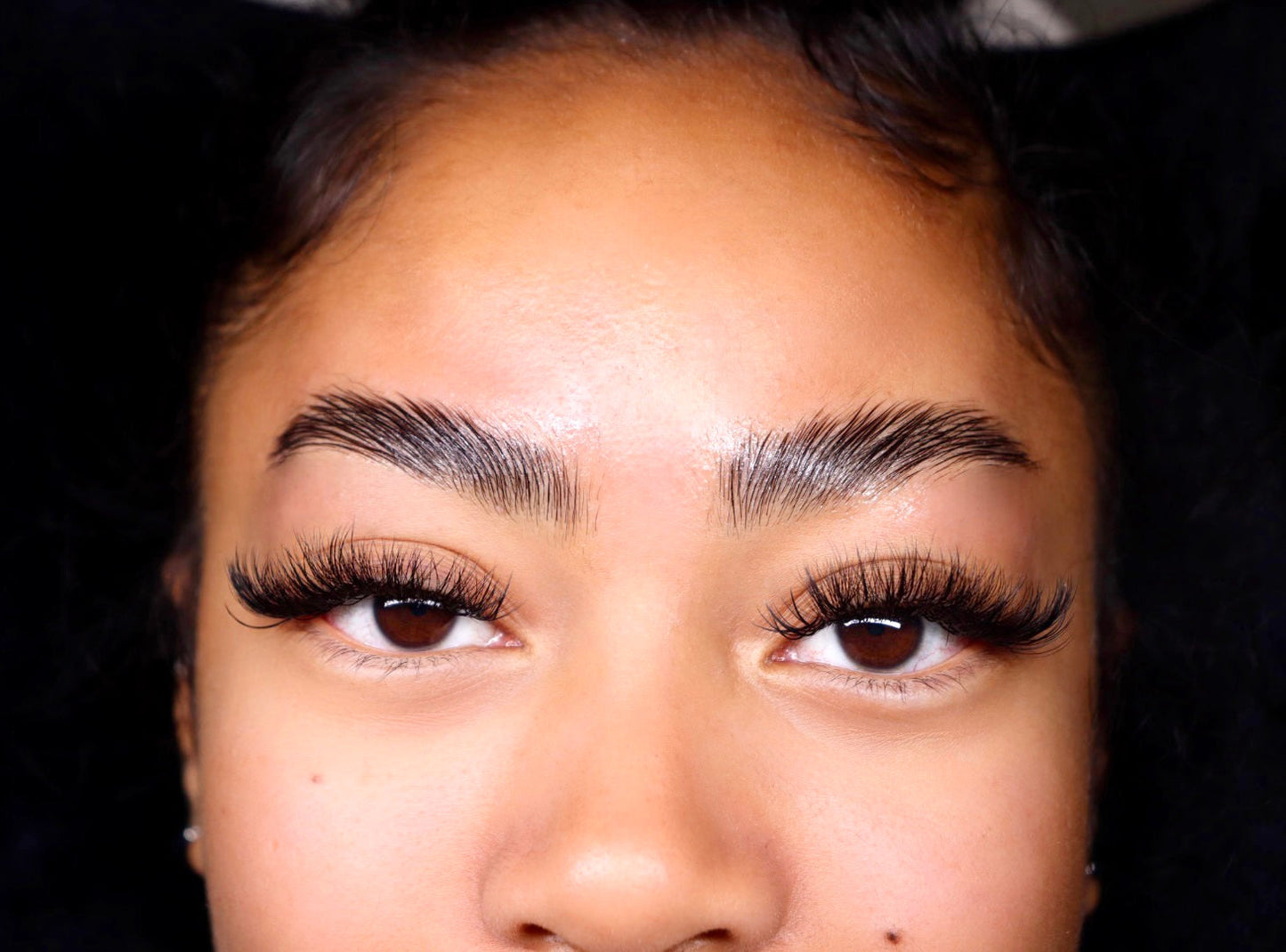 photo of a woman with big eyelashes and wide eyebrows